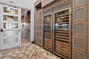 A set of wooden doors with glass panels and decorative designs.